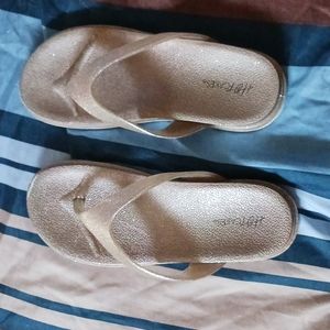 Rose gold flip flops